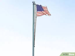 The british naval ensign or flag of the british merchant navy, a red flag with the union flag in the upper left corner. How To Properly Hoist A Flag Everything You Need To Know