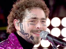 On post malone's left hand a portrait of john f kennedy can be seen. Look Post Malone Shaves His Head For A Brand New Skeleton Tattoo Spin1038