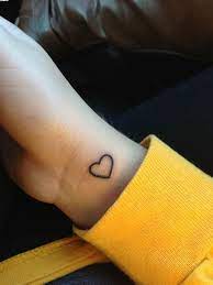 The blackwork on this tattoo contrasts with the skin, making it the center of attention on the arm. 10 Small Heart Wrist Tattoo Ideas Heart Tattoo Tiny Tattoos Mini Tattoos