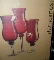 Want to create a display that effortlessly transitions from holiday to everyday? New Set Of 3 Red Glass Hurricane Candle Holders On Popscreen