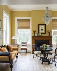 Antique Cane Sofa And Chandelier Walls In Concord Ivory Benjamin Moore Yellow Walls Living Room Mustard Living Rooms Yellow Living Room