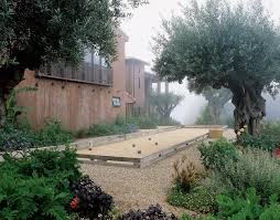 Proper drainage is critical to avoid water pooling in the court. On A Roll Garden Design