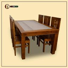 It features a rectangular tabletop with alternating linear patterns and 4 curved legs to keep it steady. Contemporary Styled 6 Seater Dining Set In Teak Wood