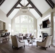 20 Vaulted Ceiling Ideas To Steal From Rustic To Futuristic Vaulted Ceiling Living Room Cathedral Ceiling Living Room Chandelier In Living Room