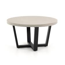 The angled legs and distressed metal the luxury linens we can't get enough of. Cyrus Outdoor Round Coffee Table Black Frame With Light Grey Top Scenario Home