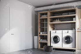 In a modern home, a laundry room would be equipped with an automatic washing machine and clothes dryer, and often a large basin, called a laundry tub. Modern Laundry Room Interior With White Brick Walls Wooden Consoles Stock Photo Picture And Royalty Free Image Image 87044954