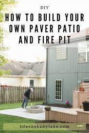 A paver patio is excavation, moving the debris, grading down to the sub soil 8 inches: Diy Patio With Grass Between Pavers And A Fire Pit