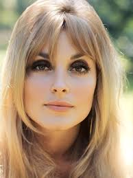 August 12, 1959: Sharon Tate, the abdicating Miss Richland, and Patti  Stewart, her successor, are shown sharing the royal robes and banner that  go with the position. Stewart became the new Miss