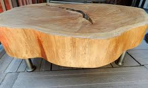 Stylish chrome ring table made from solid chromed metal rings and a floating glass top. Tree Rings Tree Rings Wood Slab Table Trunk Furniture