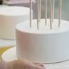 Remove baked cake from the pan by running a thin edged spatula around the sides to loosen it, then let it cool to room temperature before removing the parchment paper. 1