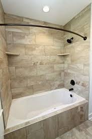 On the floors, carrara venato 2 octagon polished mosaic tile, on the walls, white glass subway tile with rope trim, and finally, on the shower and recessed shelf, carrara bianco polished 3 hexagon marble mosaic tile. Best Photos Bathroom Remodel Bathtub Tips Pop Quiz What S The Average Quantity Of Space In 2021 Bathroom Tub Shower Combo Bathroom Tub Shower Bathroom Remodel Master