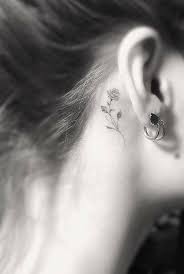 Rose Tattoo Behind The Ear Brown Hair In A Bun Arm Tattoos For Girls Arm Brown Bun Ear Tiny Tattoos For Women Small Girl Tattoos Unique Small Tattoo
