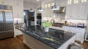 You can either choose a light waterfall kitchen island countertop that has a stark contrast with dark wooden cabinetry. Kitchen With Black Galaxy Granite Novocom Top