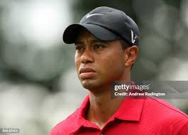 Ricky Barnes hands a club to caddie Andy Barnes after playing his... News  Photo