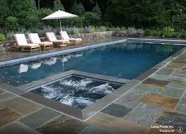 Would Love To Remodel My Pool Moving The Jacuzzi Into Our Rectangular Pool Like This Picture It Will Give Us More Pa Rectangle Pool Pool Patio Stone Pool Deck