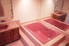 Lowes bathroom designs with dark colours popping out of a glossy marble wall tiles is a captivating style worth trying. Kindred Homestead