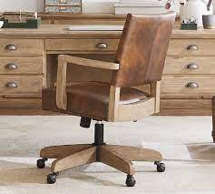 My current desk chair doesn't. Manchester Leather Swivel Desk Chair Pottery Barn