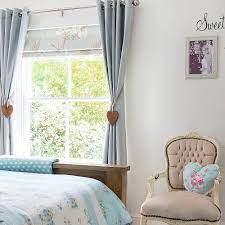 Color block curtains for small basement windows cottage bedroom features three windows dressed in white roman shades placed over a decorative oar lining a wall above a bed dressed in white bedding and taupe pillows flanked by white linen nailhead open nightstands illuminated by rope wall sconces. Bedroom Curtain Ideas To Create A Cosy And Peaceful Sleeping Space