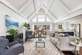 Light wood ceiling beams contrast with the room's dark gray walls and rich blue floor. á‰ Cathedral Ceiling Design Guide Unique Ideas Decor And Designs