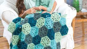 Can you see the world blooming? Crochet Flower Throw Afghan Pattern The Crochet Crowd
