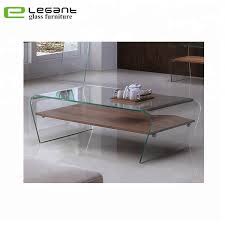 Is a piece that makes a truly dramatic style in any space. Clear Bent Glass Coffee Table With Grey Wood Veneer Shelf China Coffee Table Glass Coffee Table Made In China Com