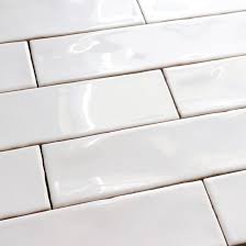 It is the use of glass mosaic tiles as the pair of combinations between 3×6 white subway tile and white grout. China 75x300mm Home Decoration Interior Design White Wavy Edge Ceramic Wall Tile China Subway Tile White Subway Tile