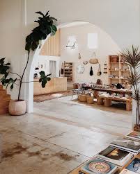 The Architecture In This Room Helps Show A Retail Design The Arch Leads People To Walk Farther Into Home Decor Inspiration White Washed Floors House Interior