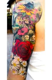 Butterfly tattoos have a lot of meanings depending on what perspective you will view it. Colorful Sleeve Butterfly And Flowers Tattoo Idea