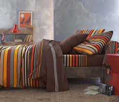 Surrounding the bed are very pink walls and a beautiful white carpeted area. Modern Bedding Sets Bedroom Interior Trends 2012