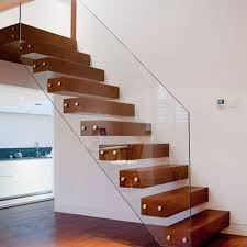 A monostring staircase fits well into a modern house. Floating Stair Solid Wood Treads Floating Stair Glass Balustrades And Wood Treads Floating Staircase Pr Floating Staircase Floating Stairs Modern Stair Railing