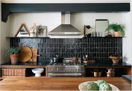 The kitchenette employs matte black textured backsplash, sink and cabinets. Black Tile Backsplashes Done Right Centsational Style