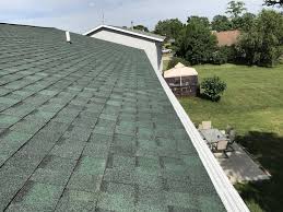 Since black or dark colored shingles absorb more heat, they would suit roofs in colder climates better. Stevensville Roof Solution Gutter Guard Project Dennison Exterior Solutions Gutter Topper