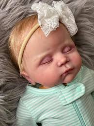 Cuddle baby Lydia by Linda Murray is ready for adoption! Premium rooted  hair and lashes Lightly weighed See video showing movement. Very poseable.  Fits preemie or smaller newborn clothes. Comes with magnetic