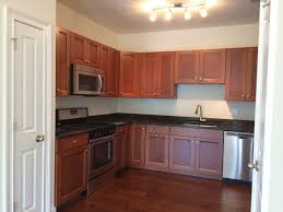 Contractor cedar shim grk fasteners #8 x 2 in. American Woodmark Delray Maple Cognac With Tan And Brown Granite Kitchen Cabinets Decor Kitchen Renovation Kitchen Remodel