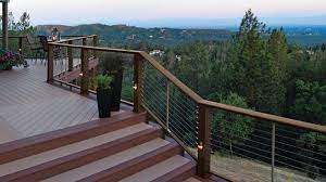 A Multi Level Deck With Expansive Views Features Timbertech Evolutions Rail In Traditional Walnut Finish With Cable Infill Decks Backyard Building A Deck Deck