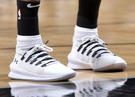 She has purple eyeshadow and red lipstick, and wears a. Nba Kicks Of The Night