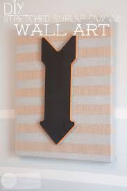 Burlap rolls can be used for rustic wedding themes as tablecloths and table runners and can also be utilized as tree wrap to protect shrubbery and other plants in the winter. Diy Burlap Canvas Wall Art Southern Revivals