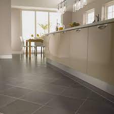 Grey cabinets with black counters wood floors countertops. Cream Kitchen Cabinets With Dark Countertops And Grey Floors Google Search Modern Kitchen Tiles Modern Kitchen Tiles Design Beautiful Kitchen Tiles