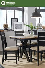 The Braydon Dining Set Is Ideal For Casual Dining The Table Features A Two Tone Design With X Shaped L Black Dining Chairs Dining Room Design Dining Room Sets