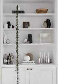 How To Style Beautiful Shelves These Four Walls See more ideas about shelf styling, interior, bookshelf styling.