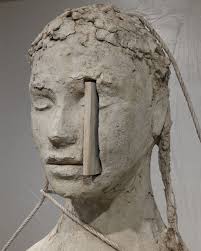 Works from “Silent Studio” by Mark Manders Bonewhite Clay Head with Two  Ropes 2018-2024 painted bronze, plywood board, plastic sheet, 3 iron stands  98.5 x 64 x 82 cm (sculpture) Photo: Keizo