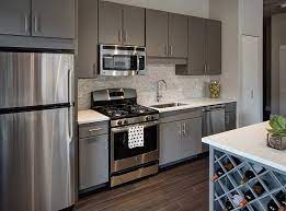 This metal light features frosted glass diffusers and three secretly love cream kitchen cabinets heather design light colored. 850 S Clark St Chicago Il 60605 In 2020 Grey Kitchen Cabinets Hardwood Floors In Kitchen Kitchen Cabinets