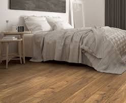 Piedmont Oak Has A Warm Amber Color With Undertones Of Golden Brown And Wider Longer S Bedroom Laminate Flooring White Laminate Flooring Oak Laminate Flooring