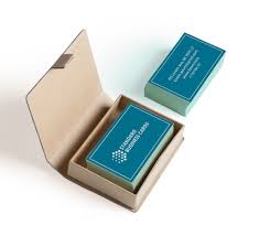 Caucasian middle aged man holding business card toward viewer. Buy The Best Quality Custom Business Cards In New Zealand Bannerbuzz