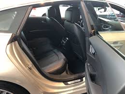 View Of The Rear Seats From Outside On The 2018 Audi A7 In Flourett Silver Metallic With Black Interior Leather Standard Audi Dealership Used Luxury Cars Audi