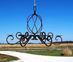 Check out our wrought iron chandelier selection for the very best in unique or custom, handmade pieces from our chandeliers & pendant lights shops. Maladroit Instant George Eliot Outdoor Hanging Candle Chandelier Merlotandbrusselsprouts Com