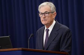 Fed lowers interest rates, signals more cuts ahead; Miran dissents | Reuters