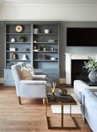Design ideas for a large farmhouse open plan living room in other with concrete flooring, grey floors, white walls, no fireplace, a wooden fireplace surround and a wall mounted tv. 75 Beautiful Traditional Living Room Ideas Designs July 2021 Houzz Uk