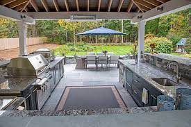 Located at a nice a outdoor patio, the outdoor kitchen is strategically placed at a wall covered by the roof eaves, protecting most of the cabinets/appliances installed. Covered Outdoor Kitchen Ideas Things To Consider