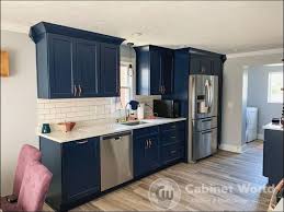 Kitchen design with gold accents. Navy Kitchen Design By Kristen Murphy Cabinet World Of Pa